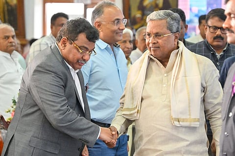 CM Siddaramaiah greets Industries Minister MB Patil at the launch of the KWIN City project on Thursday.