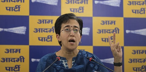Delhi CM Atishi addresses a press conference at party office in New Delhi on Saturday.