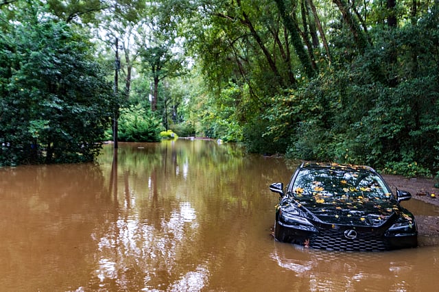 A partially submerged vehicle sits in flood water from after Hurricane Helene passed the area, in Atlanta.