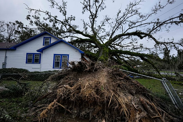 A damaged 100-year-old home is seen after an Oak tree landed on it after Hurricane Helene moved through the area in Valdosta, Georgia.