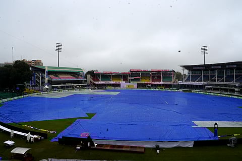 Covers placed on the ground following rains, during the second day of the 2nd Test cricket match between India and Bangladesh, at the Green Park Stadium, Kanpur.