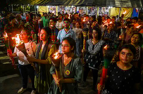 Junior doctors participate in torch rally, demanding justice for the trainee doctor, a victim of rape and murder, in Kolkata, Sunday, Sept. 29, 2024.