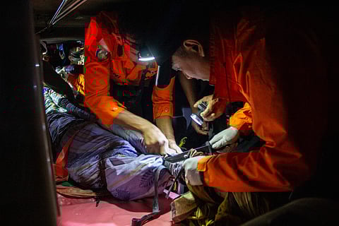 A recovered body is carried to an ambulance after a landslide occurred at an illegal gold mining site in Solok, West Sumatra, on September 28, 2024.