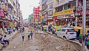 BVK Iyengar Road in Chickpet has little room for shoppers with one side of the road blocked for white-topping work and the other jam-packed with traffic