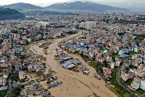 In this aerial image of the Kathmandu valley, Bagmati River is seen flooded due to heavy rains in Kathmandu, Nepal, Saturday, Sept. 28, 2024. 