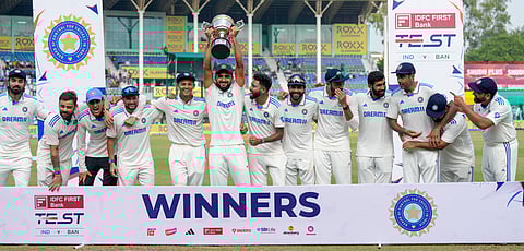 Indian players pose with the trophy after winning the second Test against Bangladesh (Photo | PTI)
