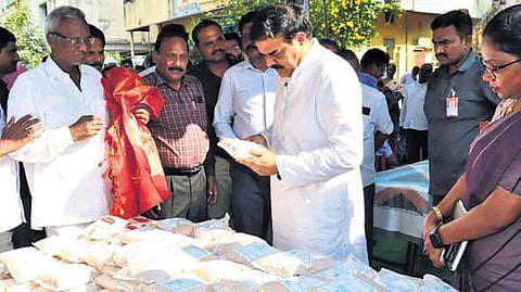 Civil Supplies Minister Manohar distributes essentials to ration card holders 