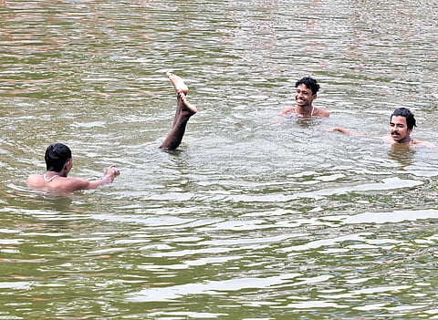 A group of boys enjoying a swim in the Rishimangalam Sreekrishna Swamy Temple pond at Vanchiyoor in Thiruvananthapuram. The capital is on high alert after the reporting of amoebic meningoencephalitis cases 