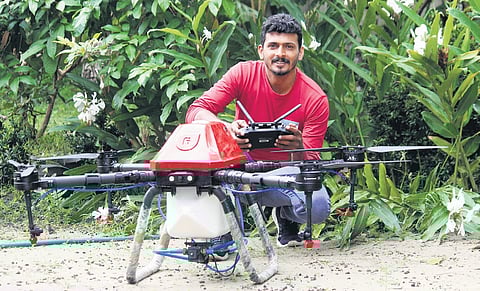 Mannar native Sameer P. with the drone that he uses to spray pesticide on the paddy field at Kuttanad in Alappuzha 