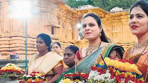 Women in traditional attire reach the Thousand Pillar Temple in Warangal for the first day of Bathukamma festival on Wednesday