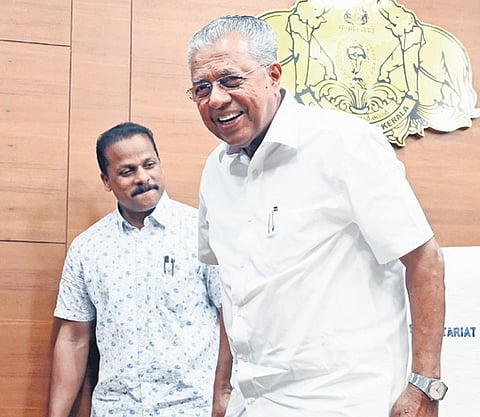 CM Pinarayi Vijayan smiles at reporters as he leaves the media chamber in the Secretariat.