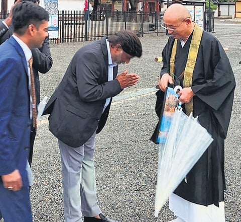 Deputy Chief Minister Mallu Bhatti Vikramarka receives blessings from a monk at the Toji temple, Kyoto, Japan.