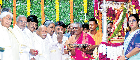 CM Siddaramaiah, Dy CM DK Shivakumar, scholar Hampa Nagarajaiah, ministers Dr DC Mahadevappa and HK Patil offer floral tributes to Goddess Chamundeshwari atop Chamundi Hills, in Mysuru