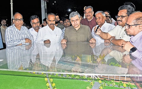Railway Minister Ashwini Vaishnaw looks at the scale model of the proposed redevelopment work of Cantonment Railway Station on Saturday.