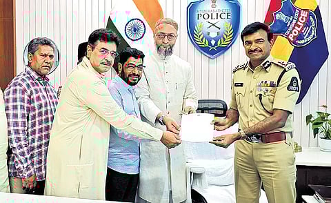AIMIM leaders, led by Asaduddin Owaisi, hand over a representation demanding the arrest of Yati Narsinghanand, to Hyderabad Police Commissioner CV Anand on Saturday 