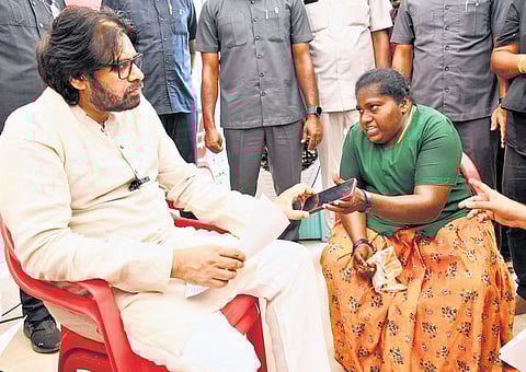 Deputy Chief Minister Pawan Kalyan interacting with K Sujana Kumari, an RWS staffer in Kamalapuram lab of YSR district, in Mangalagiri 