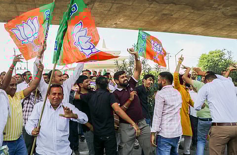 BJP Supporters celebrate party candidate Surinder Bhagat's win in the Jammu and Kashmir Assembly elections, in Jammu, Tuesday, Oct. 8, 2024
