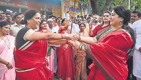 With the party’s win in the Haryana Assembly elections, BJP workers break into celebrations in faraway Mumbai on Tuesday.