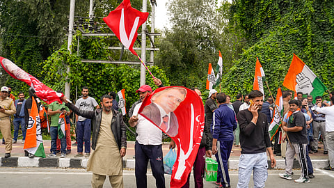 Congress party and National Conference supporters celebrate J&K Assembly poll results, in Srinagar