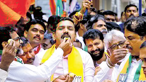 State BJP president BY Vijayendra and other senior party leaders celebrate the party’s performance in the Haryana and Jammu and Kashmir Assembly elections, at the party office in Bengaluru on Tuesday  