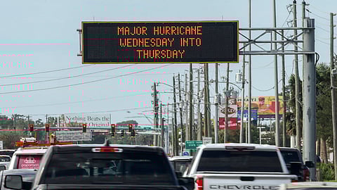 Highway signage announces the impending arrival of Hurricane Milton and the evacuations zones on Tuesday.