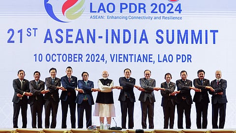 Prime Minister Narendra Modi along with Secretary-General of ASEAN, Dr. Kao Kim Hourn and other dignitaries hold hands during the 21st ASEAN-India Summit, in Vientiane on Thursday, Oct. 10, 2024.