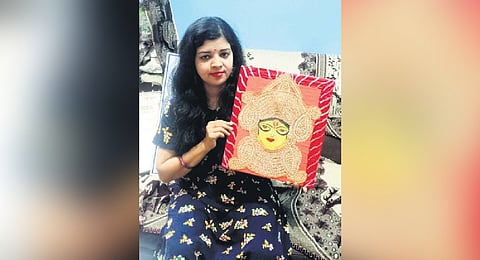 Teacher makes Durga idol using 3,057 paddy grains, wins laurels