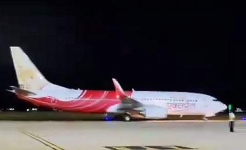 Air India flight after it landed safely following a mid-air glitch, at the Trichy Airport on Friday,