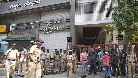 Security personnel outside the residence of Baba Siddique, a day after he was shot dead.