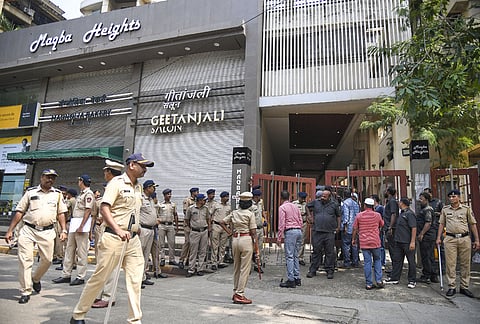 Security personnel outside the residence of Baba Siddique on Sunday, Oct. 13, 2024.  
