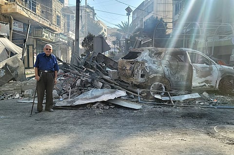 Destroyed buildings at a commercial street that was hit Saturday night by Israeli airstrikes, are seen in Nabatiyeh town, south Lebanon, Sunday, Oct. 13, 2024.