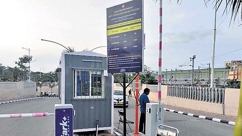 Boards display rates at one of the access-control gates at Sir M Visvesvaraya Terminal at Baiyappanahalli 