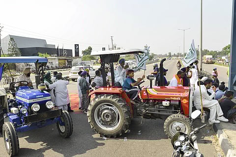 Farmers shout slogans during their protest, in Jalandhar on Sunday