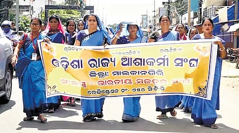 Asha workers taking out a rally in Malkangiri on Monday