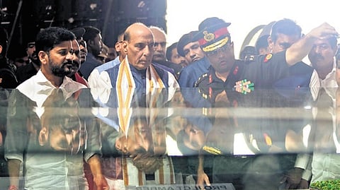 Union Defence Minister Rajnath Singh and Telangana CM A Revanth Reddy look at the VLF radar station model in Damagundam on Tuesday.