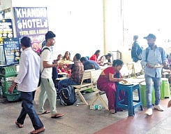 Passengers having meals at the waiting room of CNBT.