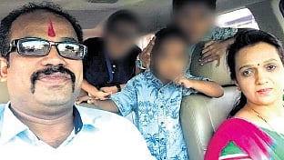 File photo of deceased Santosh with his wife and children