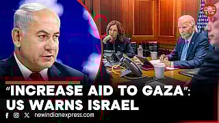 A boy carries bags after sifting through waste at a landfill in Khan Yunis in the southern Gaza Strip on October 15, 2024.