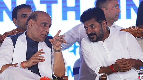 Defence Minister Rajnath Singh speaks to Chief Minister A Revanth Reddy at the stone laying ceremony for a radar station at Damagundam on Tuesday.