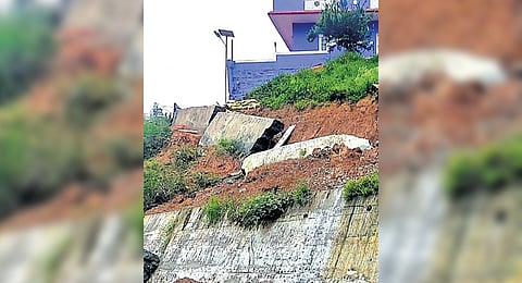 A retaining wall collapsed at Melur in Balacola Panchayat in Kundha on Wednesday
