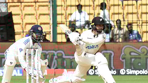 New Zealand's batter Devon Conway plays a shot during the second day of the first Test cricket match between India and New Zealand, at M Chinnaswamy Stadium, in Bengaluru, Thursday, Oct. 17, 2024.