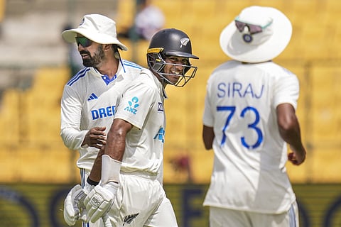New Zealand batter Rachin Ravindra being greeted by India's K L Rahul as he walks off field after his dismissal during the third day of the first cricket test match between India and New Zealand at M Chinnaswamy Stadium, in Bengaluru, Karnataka, Friday, Oct. 18, 2024.