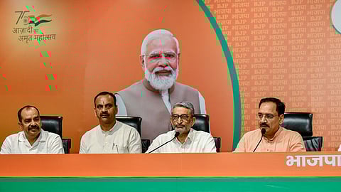 Delhi BJP President Virendra Sachdeva (R) addresses in the presence of former Aam Aadmi Party (AAP) MLAs Kartar Singh Tanwar (2R) and Ratnesh Gupta and AAP Councillor Umed Singh Phogat as they join the BJP at party headquarters in New Delhi on Wednesday, June 10, 2024.