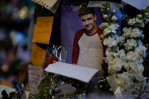 A picture of former One Direction singer Liam Payne adorns a memorial outside the hotel where he was found dead after falling from a balcony in Buenos Aires, Argentina, 