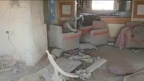 This still image from video provided by the Israel Defense Force (IDF) shows a heavily damaged building with a person the Israeli military identified as Hamas leader Yahya Sinwar seated in a chair in Rafah, Gaza Strip, on Wednesday, Oct. 16, 2024. 