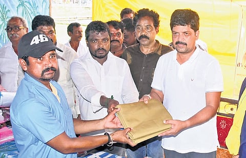 Excise Minister Kollu Ravindra distributed uniforms worth Rs 5 lakh to sanitation workers of Machilipatnam Municipal Corporation on Sunday