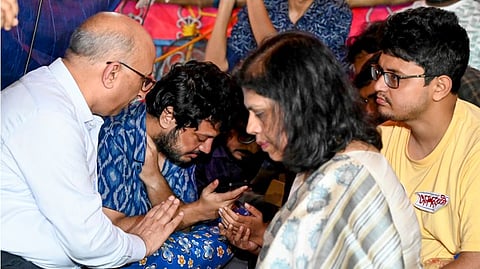 Junior doctors, observing fast-unto-death, talk to West Bengal Chief Minister Mamata Banerjee over the phone in the presence of Chief Secretary Manoj Pant and Home Secretary Nandini Chakraborty at the protest site, in Kolkata.