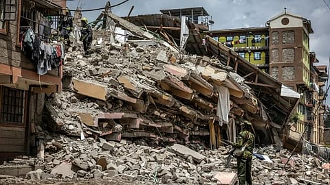 Kenya Police officer and Nairobi County emergency responders inspect the rubble of a collapsed residential building at Kahawa West residential area in Nairobi on October 20, 2024.