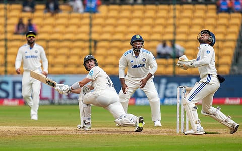 New Zealands Mitchell Santner celebrates with teammates after taking the wicket of Indias captain Rohit Sharma on the third day of the second test cricket match between India and New Zealand in Pune, Saturday, Oct. 26, 2024. 