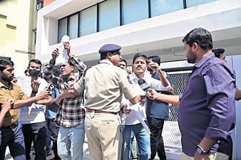 Police personnel take protesters into preventive custody at Ashoknagar in Hyderabad on Sunday
